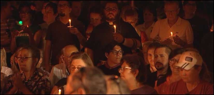 Candles, tears and song at Orlando vigil for massacre victims