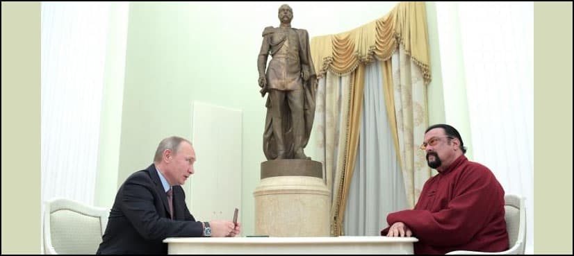 Putin hands Russian passport to action star Seagal