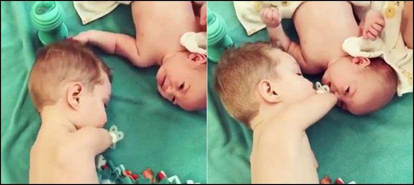 Heart-warming video: Toddler born without lower arms comforts crying baby