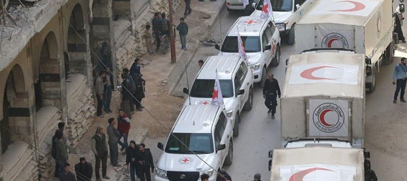 Aid reaches Ghouta but retreats after shelling; Syria presses assault