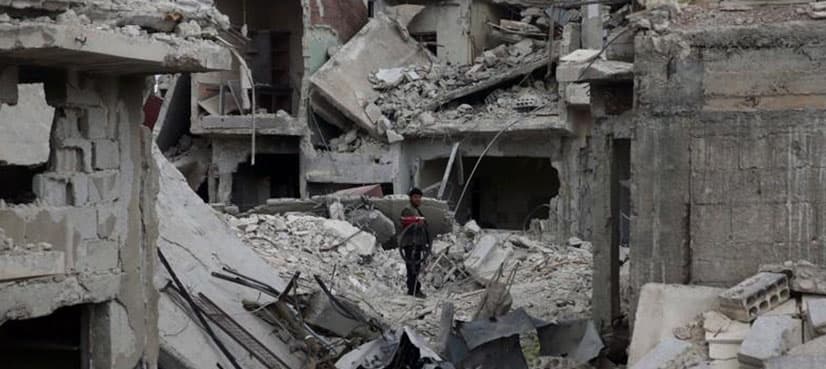 Dozens reported killed in suspected Syria gas attack, Damascus denies