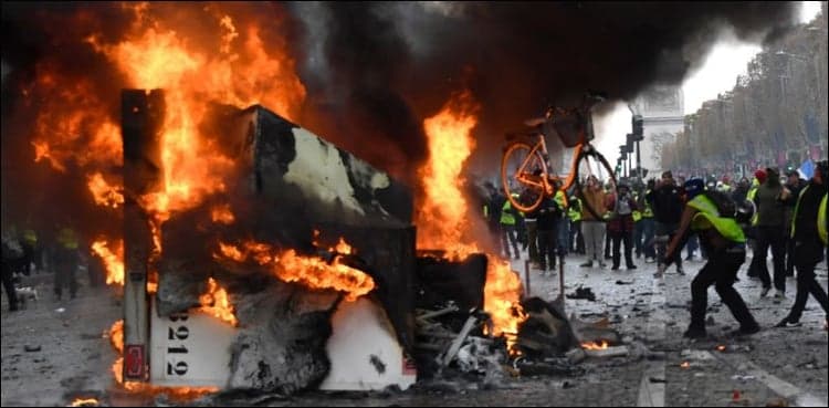 Clashes on Champs-Elysees as French protesters rage against taxes