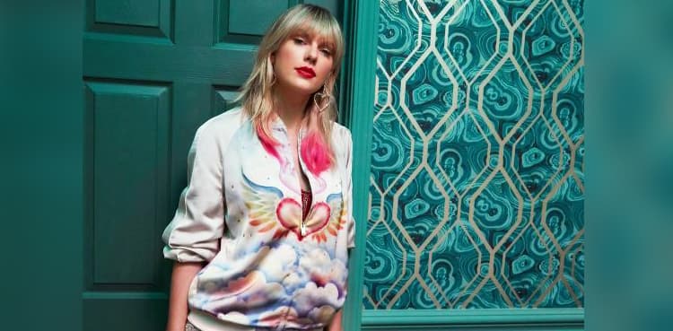 Death threats prompt music executive to appeal for peace in feud with Taylor Swift