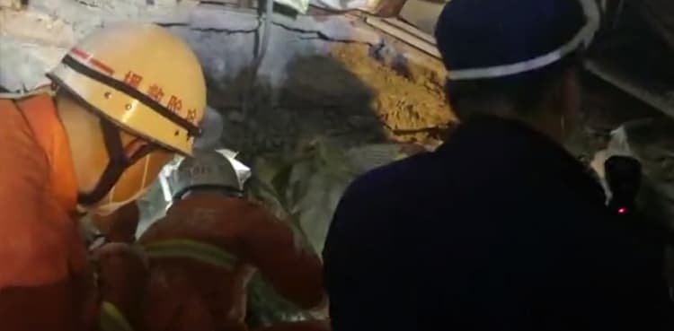Mother, child found alive in debris over 50 hours after hotel collapse