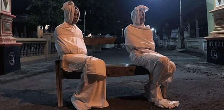 Coronavirus: Youth disguise themselves as ghosts to scare people into staying indoors