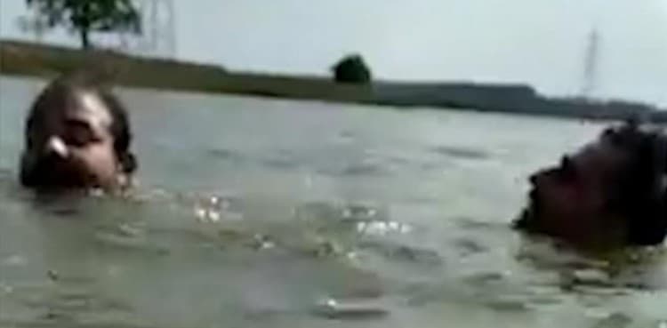 WATCH: Swimmer dragged underwater by crocodile before his friend saves him
