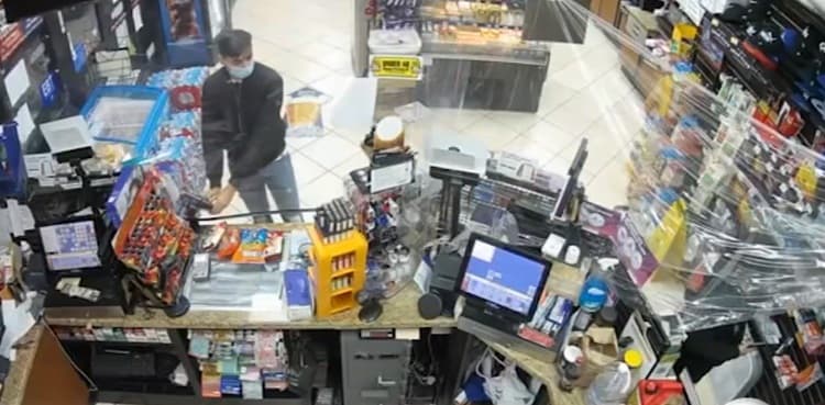 Felon caught on CCTV mounting skimming device on credit card machine
