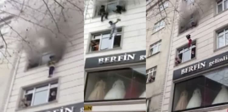 WATCH: Mother throws her four children from burning building to save them