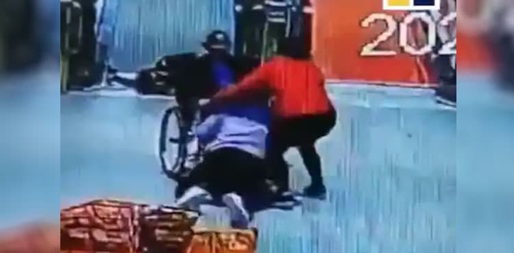 WATCH: Woman saves elderly man in wheelchair rolling down escalator