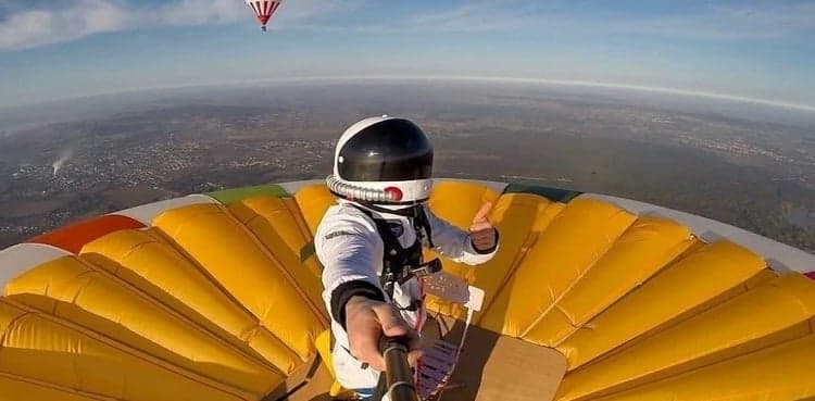 Man smashes record for standing atop hot-air balloon at 13,175 feet