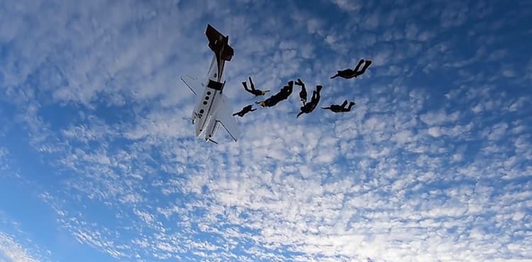 Terrifying video shows moment skydivers jump as stalled plane plummets