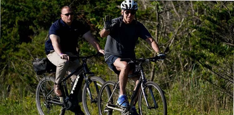 Biden falls after flubbing bike dismount