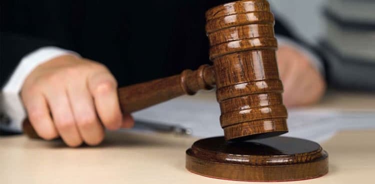 Kuwait court jails dozens, including a senior official in corruption case