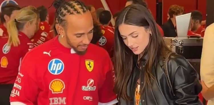 Lewis Hamilton brings out his smile during garage tour at Abu Dhabi Grand Prix