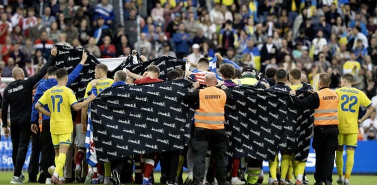Denmark's Eriksen in 'good spirits' after collapsing during friendly