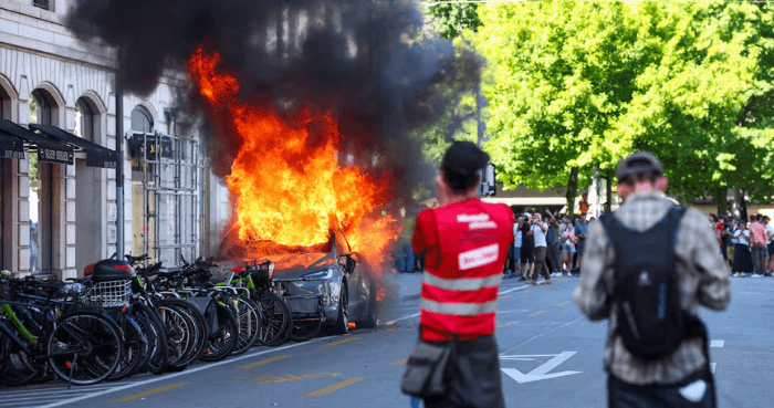 Protesters set Tesla ablaze, smash UN office's windows in Geneva anti-G7 march