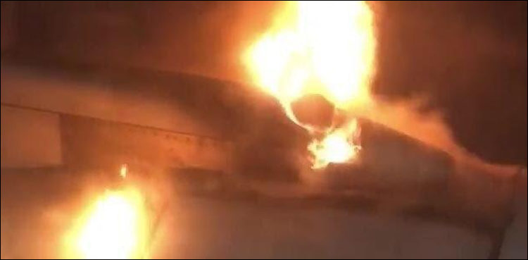 Image result for Fire erupts in a grounded aircraft at Karachi airport