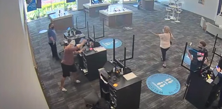 woman crowbar steal money spectrum armed robbery