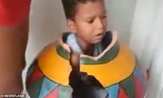 boy trapped clay vase home playing video