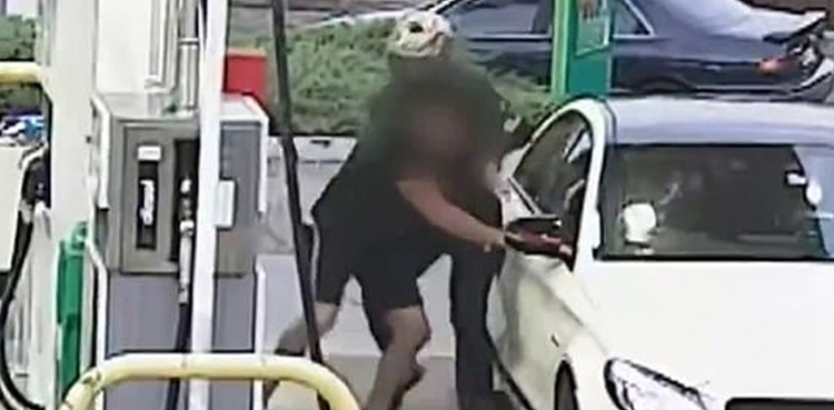 carjackers driver knife petrol station cctv footage