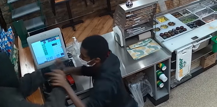 WATCH: Employee fights and chases robbery suspect at fast-food chain