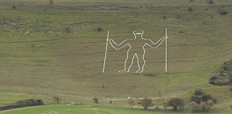 COVID-19 face mask painted on giant English chalk figure