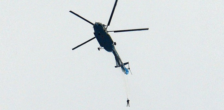 WATCH: Soldier left dangling from helicopter after parachute jump fail