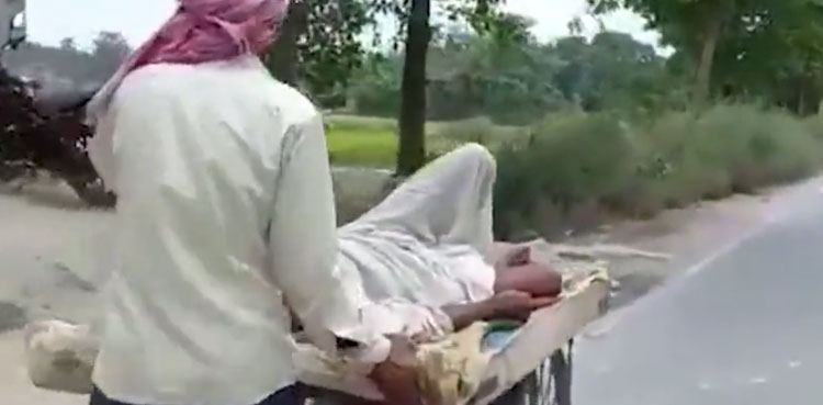 Tragic video: Indian man carrying dying father to hospital on wooden handcart