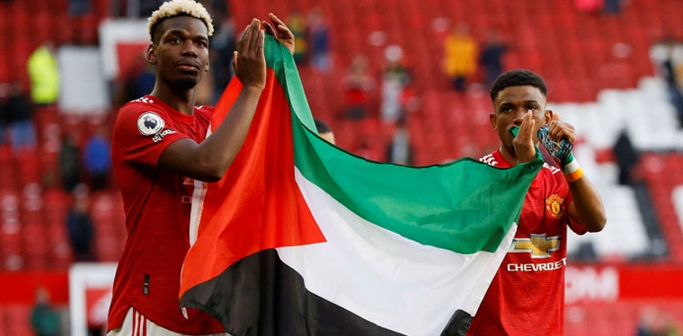 Soccer stars Pogba, Diallo hold up Palestine flag at Old Trafford