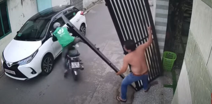 bike rider narrowly escapes gate