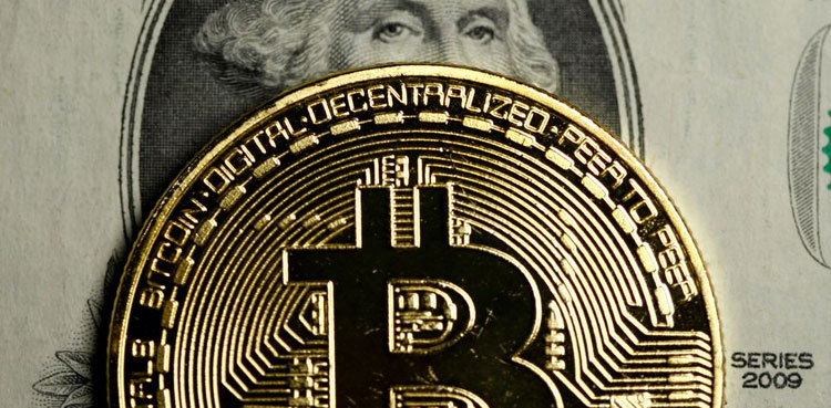 Bitcoin slides to four-month lows on liquidation fears