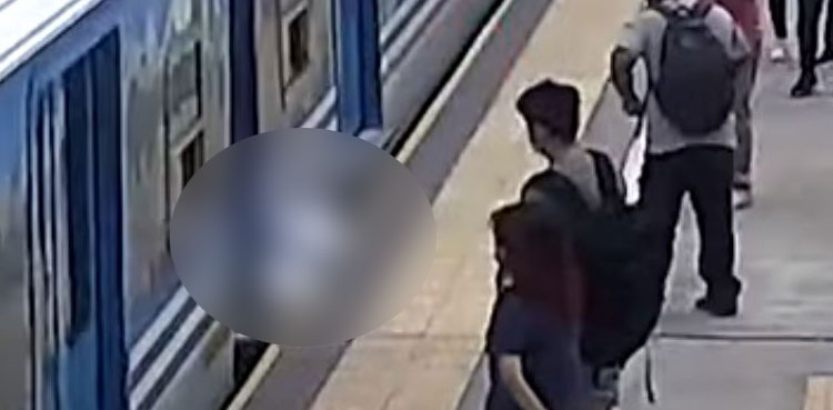 VIRAL: Unconcious woman falling between train, railway tracks scary video