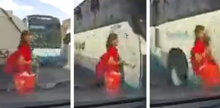 Viral video, Woman narrowly escapes death, trying to cross road