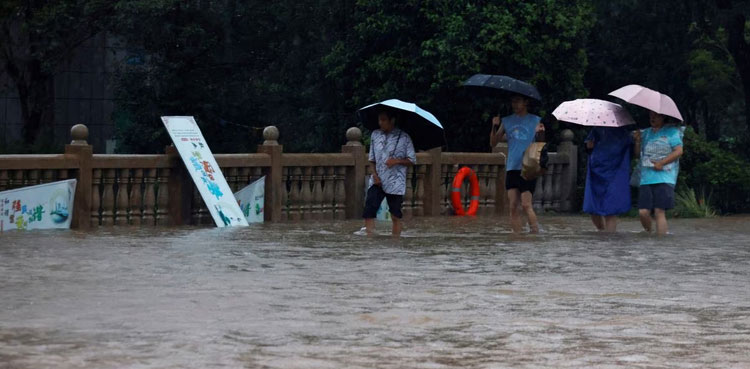 Tens of thousands evacuated as northern China hit by torrential rain