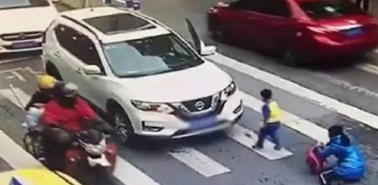 Little boy, Viral video, boy kicks car, car hits mother