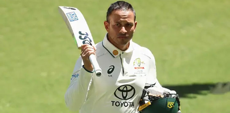 Usman Khawaja, displays dove, olive branch symbol, bat & shoes