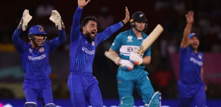 Afghanistan beat PNG to advance at T20 World Cup as NZ eliminated