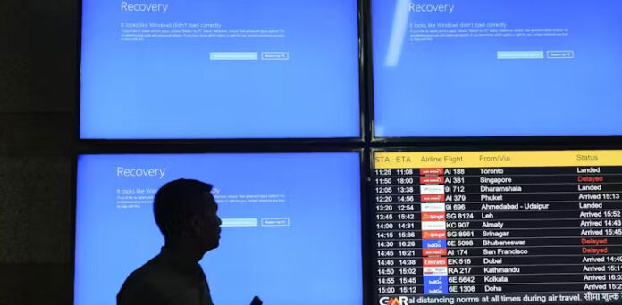 IT technician fixing a computer affected by the Microsoft outage |whispergaze